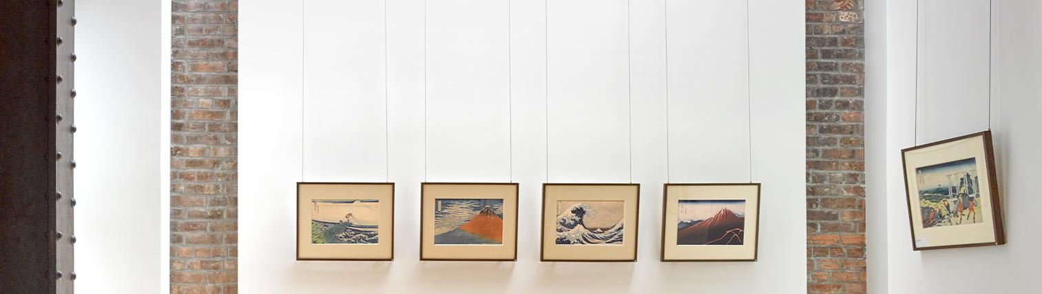 Five Hokusai prints hanging in Ronin Gallery